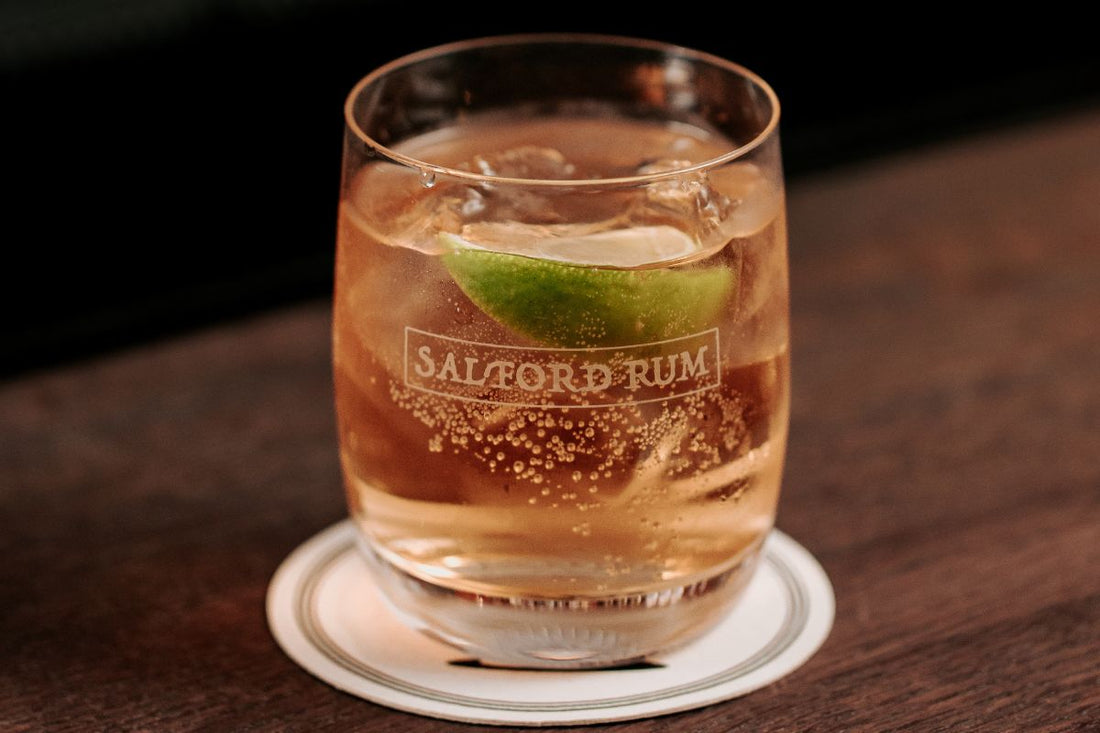 Salford spiced rum served with ginger beer and lime in a tumbler glass