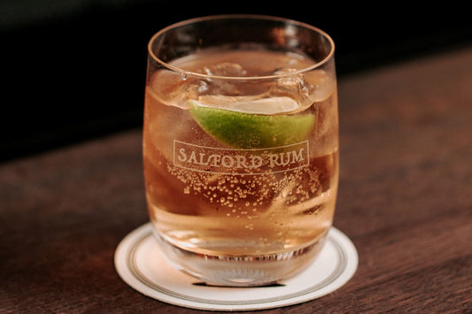 Salford spiced rum served with ginger beer and lime in a tumbler glass