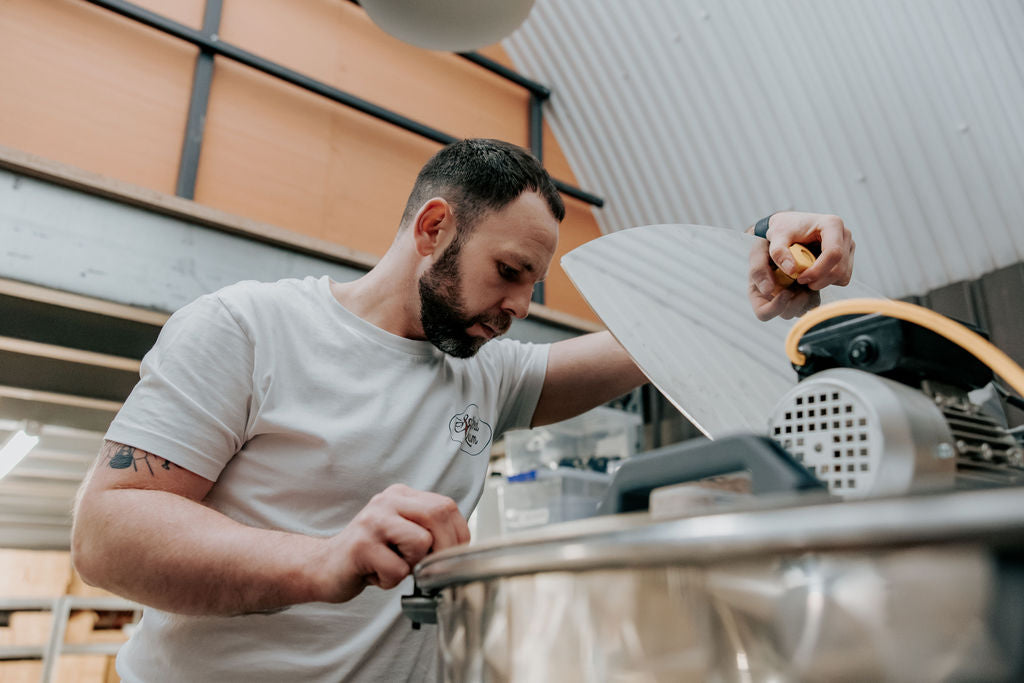 A member of the Salford Distillery team making spirits by hand