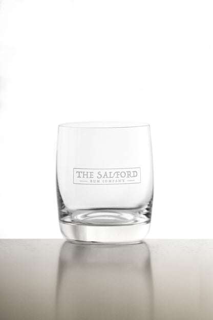 Salford Rum tumbler glass close-up showing etched logo