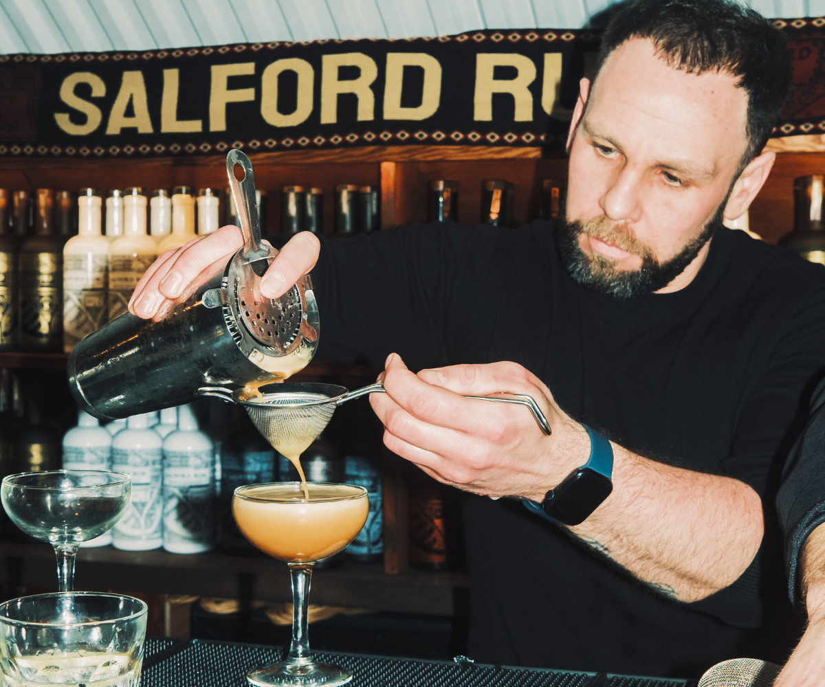 Bartender pouring cocktails at Salford Distillery