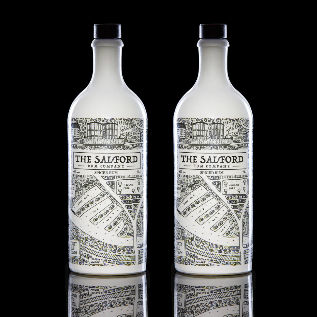 Salford Rum bundle bottles on a wooden surface