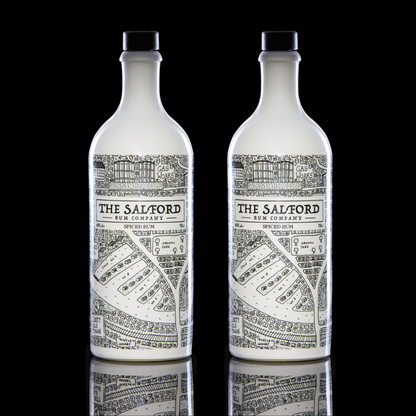 Salford Rum bundle bottles on a wooden surface